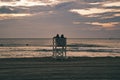 Couple on Beach Lifeguard Stand