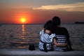 Couple at beach looking at sunset