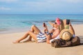 Couple on the beach with mobile phones Royalty Free Stock Photo