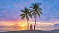 couple on beach with palm trees sunset at the tropical beach of Saint Lucia or St Lucia Caribbean Royalty Free Stock Photo