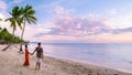 couple on beach with palm trees sunset at the tropical beach of Saint Lucia or St Lucia Caribbean Royalty Free Stock Photo