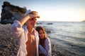 Beautiful young people in love walking. Couple on beach at sunset summer vacation Royalty Free Stock Photo