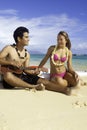 Couple on beach with ukulele Royalty Free Stock Photo