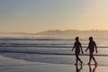 Couple on the beach in Loredo, Spain