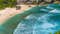 Couple on beautiful Atuh Beach with White Long Waves, Nusa Penida, Bali, Indonesia