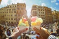 Couple with beautiful bright sweet Italian ice-cream with different flavors in the hands