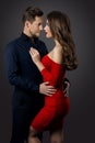 Couple Beauty Portrait, Beautiful Woman in Red dress embracing Elegant Man, Face to Face Royalty Free Stock Photo