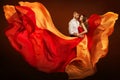 Couple Beauty Portrait, Man and Dreaming Woman in Waving Dress as Flame on Wind Royalty Free Stock Photo