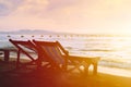 Couple bed chair set on the beach with sun twilight calm sunset sky background Royalty Free Stock Photo
