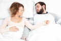 Couple in bed. Man snoring and woman can`t sleep