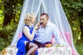 A couple on bed in meadow Royalty Free Stock Photo