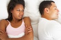 Couple In Bed With Relationship Difficulties