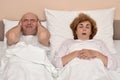 Woman snoring while man cannot sleep Royalty Free Stock Photo