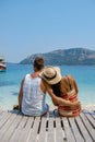 Couple from behind on the backside looking out over ocean of tropical Island, beautiful tropical island beach - Koh Kham Royalty Free Stock Photo