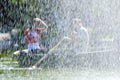 Couple behind fountain. Royalty Free Stock Photo