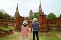 Couple being impressed by the awesome temple ruins in the Ayutthaya Historical Park, Ayutthaya, Thailand