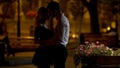 Couple of beloved going to kiss, romantic date in park, evening time, love