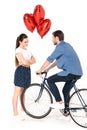 Couple with bicycle and balloons