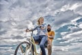 Couple with bicycle romantic date sky background. Psychology of relationships. Leadership in family and marriage. Girl Royalty Free Stock Photo