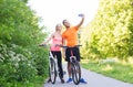 Couple with bicycle taking selfie by smartphone Royalty Free Stock Photo