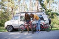 Couple of bicyclists standing on the road