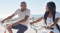 Couple, bike and beach for fun bonding in a happy, loving relationship in Cape Town, Sea Point. Cycling, fitness and Royalty Free Stock Photo