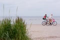 Couple on a bike ride along the beach Royalty Free Stock Photo