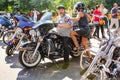 A couple of bikers on a motorcycle.