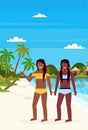 Couple bikini women on tropical island with villa bungalow hotel on beach seaside green palms landscape summer vacation