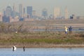 Couple birding with Manhattan skyline background