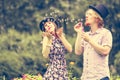 Couple blowing bubbles outdoor Royalty Free Stock Photo