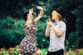 Couple blowing bubbles outdoor Royalty Free Stock Photo