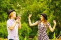 Couple blowing bubbles outdoor Royalty Free Stock Photo