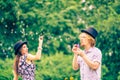 Couple blowing bubbles outdoor Royalty Free Stock Photo