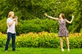 Couple blowing bubbles outdoor Royalty Free Stock Photo