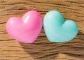 Couple of blue and red heart shapes over wooden table. Valentine Royalty Free Stock Photo