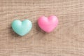 Couple of blue and red heart shapes over wooden table. Valentine Royalty Free Stock Photo