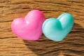 Couple of blue and red heart shapes over wooden table. Valentine Royalty Free Stock Photo