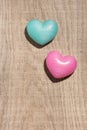 Couple of blue and red heart shapes over wooden table. Valentine Royalty Free Stock Photo