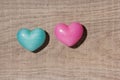 Couple of blue and red heart shapes over wooden table. Valentine Royalty Free Stock Photo