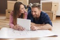 Couple with blueprints house Royalty Free Stock Photo