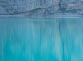 Couple in a boat in a mountain lake or pond or river calm water without wind summer