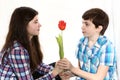 Couple boy and girl brother present flower