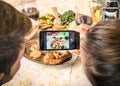 Couple of boyfriend and girlfriend taking a food selfie