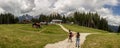 couple of boys observing the panorama near the lake of Auronzo di Cadore.