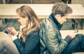 Couple in a break up phase of mutual disinterest Royalty Free Stock Photo