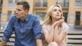 Couple breaking up, upset man and crying woman sitting on bench, divorce Royalty Free Stock Photo