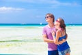 Couple in bright clothes hugging on tropical beach Royalty Free Stock Photo