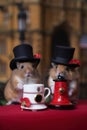 A couple of British hamsters fearing top hats. Generative AI image.