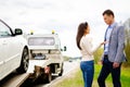 Couple and broken car on a highway Royalty Free Stock Photo